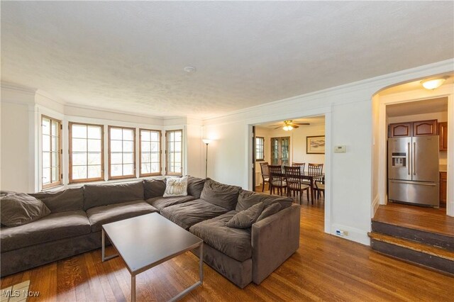 2155 Middlefield Rd, Cleveland Heights, OH 44106 - living room featuring arched walkways, ceiling fan, ornamental molding, and wood finished floors