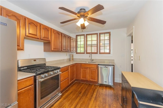 2155 Middlefield Rd, Cleveland Heights, OH 44106 - kitchen with dark wood-style flooring, ceiling fan, light countertops, a sink, and stainless steel appliances