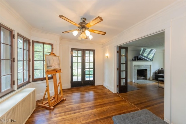 2155 Middlefield Rd, Cleveland Heights, OH 44106 - entryway featuring french doors, ornamental molding, radiator, and wood finished floors
