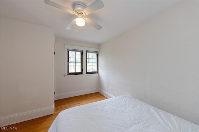2155 Middlefield Rd, Cleveland Heights, OH 44106 - bedroom with light wood-style floors, baseboards, and ceiling fan