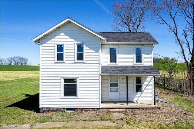 7333 Blachleyville Rd, Wooster, OH 44691 - traditional-style home featuring covered porch, roof with shingles, and a front yard