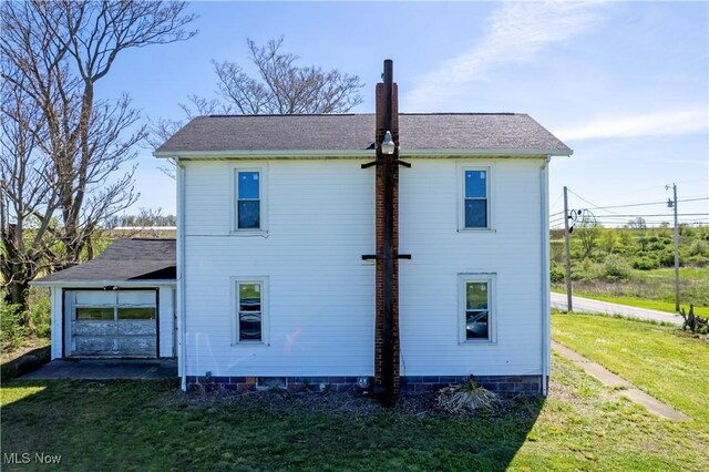 7333 Blachleyville Rd, Wooster, OH 44691 - rear view of house featuring a lawn and a shingled roof