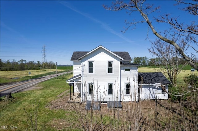 7333 Blachleyville Rd, Wooster, OH 44691 - view of home's exterior featuring a yard and roof with shingles