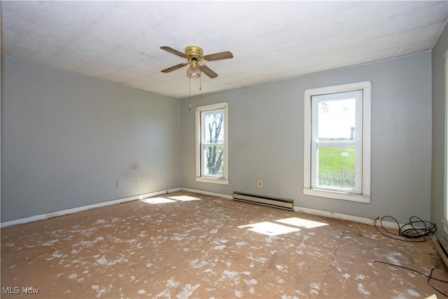 7333 Blachleyville Rd, Wooster, OH 44691 - empty room with a baseboard heating unit, baseboards, and ceiling fan