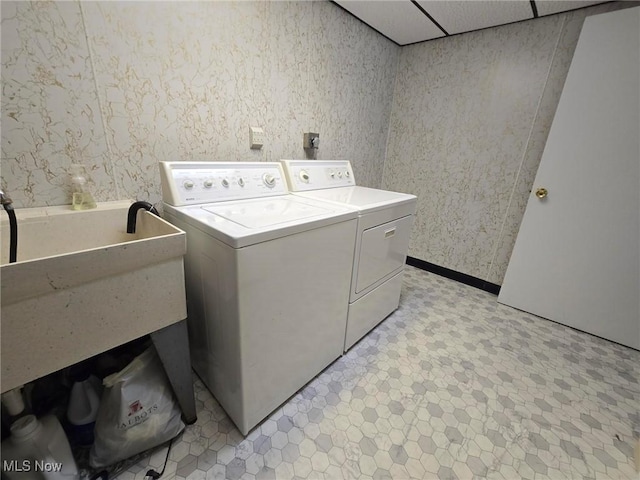 5294 Cottage Dr, Mecca, OH 44410 - clothes washing area with separate washer and dryer, laundry area, light floors, and wallpapered walls