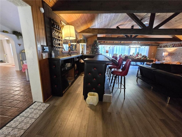5294 Cottage Dr, Mecca, OH 44410 - interior space with lofted ceiling with beams, arched walkways, a bar, and wood ceiling