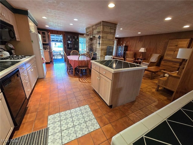 5294 Cottage Dr, Mecca, OH 44410 - kitchen with recessed lighting, tile countertops, and black appliances