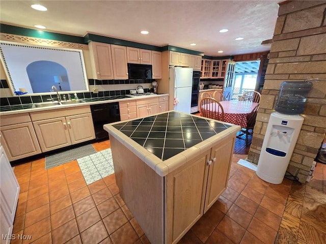 5294 Cottage Dr, Mecca, OH 44410 - kitchen featuring a sink, tile counters, black appliances, and recessed lighting