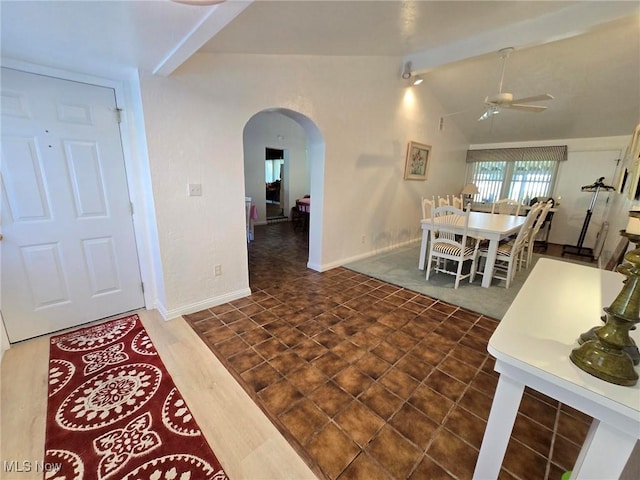 5294 Cottage Dr, Mecca, OH 44410 - foyer entrance with baseboards, a ceiling fan, arched walkways, and vaulted ceiling with beams