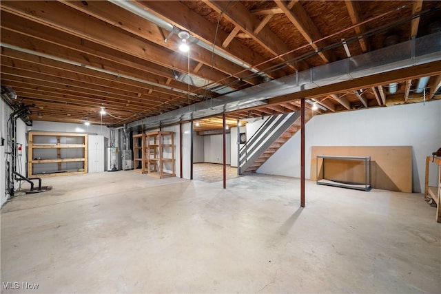 unfinished below grade area with stairway and gas water heater