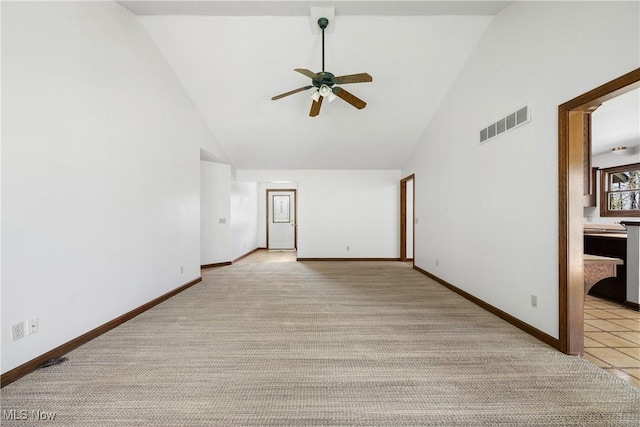 unfurnished room with high vaulted ceiling, visible vents, light carpet, and ceiling fan