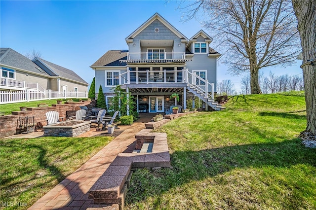 1432 Lake Vue Dr, Roaming Shores, OH 44085 - rear view of property featuring stairway, a yard, a balcony, and an outdoor fire pit