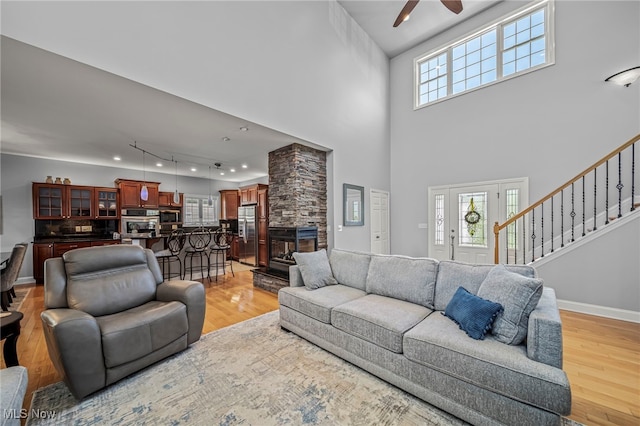 1432 Lake Vue Dr, Roaming Shores, OH 44085 - living room with light wood-type flooring, ceiling fan, and a wealth of natural light