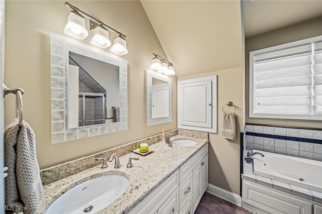 1432 Lake Vue Dr, Roaming Shores, OH 44085 - bathroom featuring a sink, baseboards, a jetted tub, and double vanity