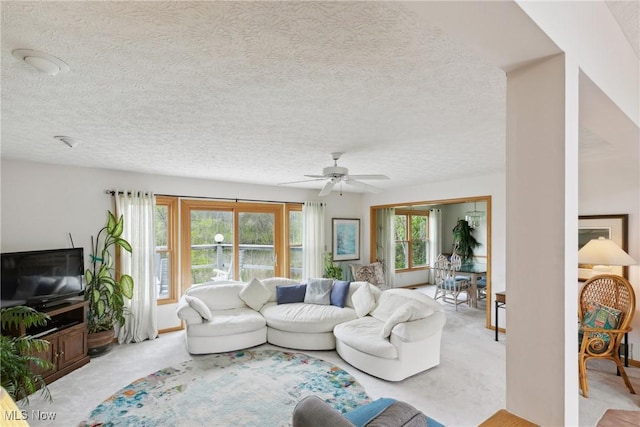 5420 Crystal Cove Cir, Stow, OH 44224 - living area featuring a textured ceiling, ceiling fan, and light carpet