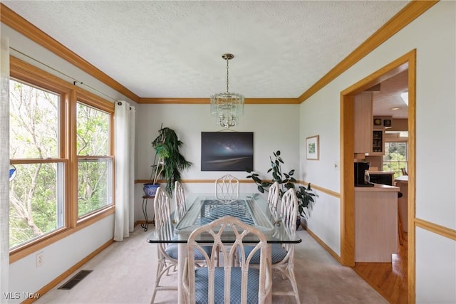 5420 Crystal Cove Cir, Stow, OH 44224 - dining room featuring visible vents, a chandelier, and a healthy amount of sunlight