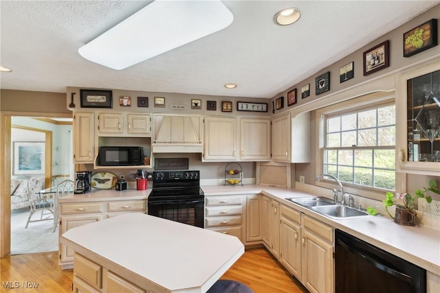 5420 Crystal Cove Cir, Stow, OH 44224 - kitchen with light countertops, a sink, black appliances, and custom range hood