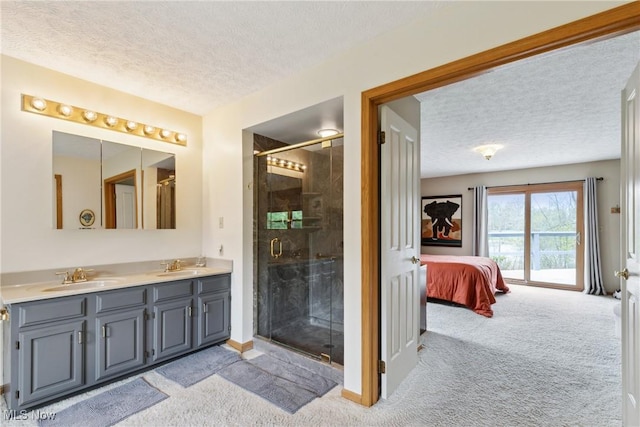5420 Crystal Cove Cir, Stow, OH 44224 - ensuite bathroom with a sink, double vanity, a shower stall, and a textured ceiling
