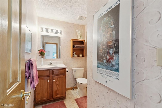 5420 Crystal Cove Cir, Stow, OH 44224 - bathroom with vanity, visible vents, toilet, a textured ceiling, and tile patterned floors