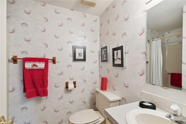 5420 Crystal Cove Cir, Stow, OH 44224 - full bathroom with toilet, a textured ceiling, wallpapered walls, and vanity