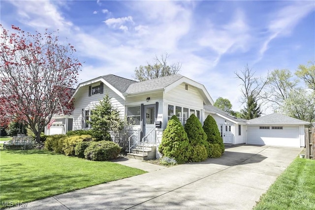bungalow-style house featuring a shingled roof, a front lawn, and concrete driveway