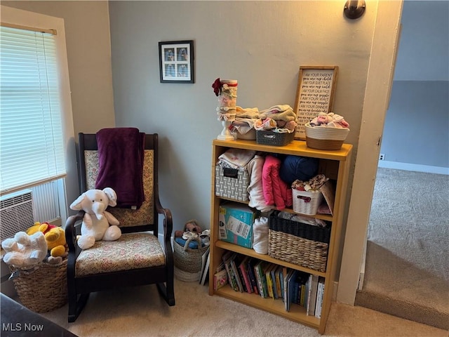 sitting room featuring carpet flooring