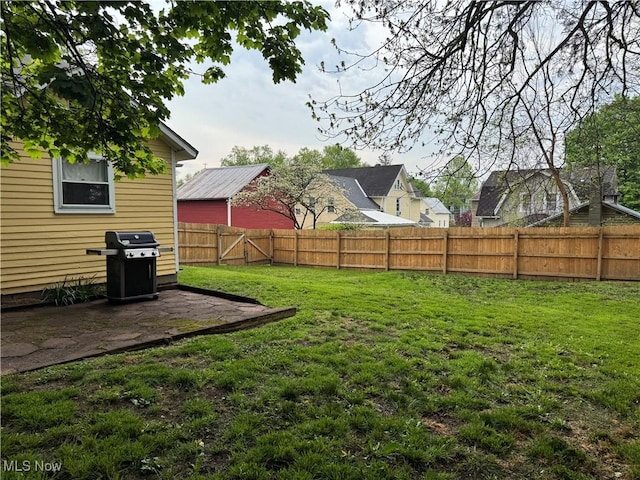view of yard with a patio and a fenced backyard