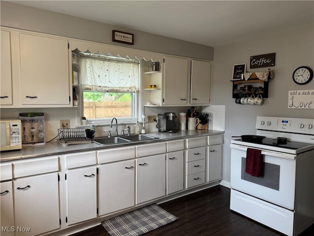 kitchen featuring a sink, decorative backsplash, white cabinets, and white appliances