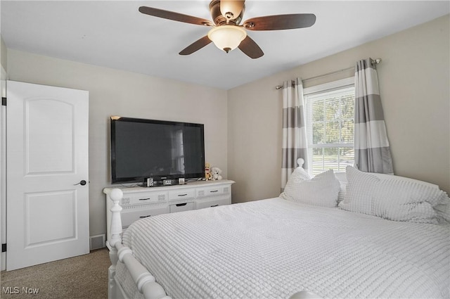 carpeted bedroom featuring a ceiling fan