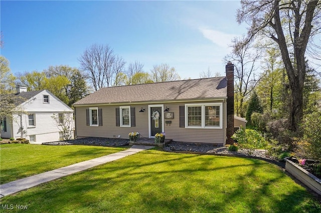 single story home featuring a front lawn and a chimney