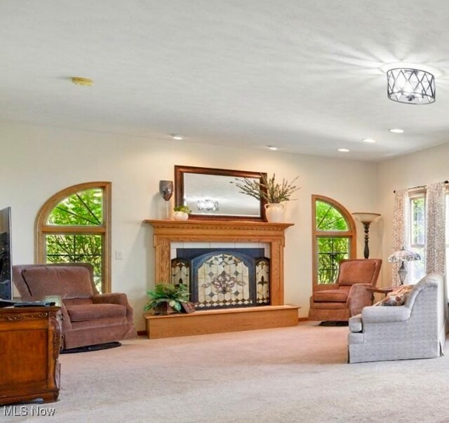 16544 Davis Dr, Calcutta, OH 43920 - living area with recessed lighting, a fireplace with raised hearth, and carpet