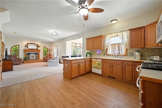16544 Davis Dr, Calcutta, OH 43920 - kitchen with plenty of natural light, white dishwasher, a sink, and light countertops