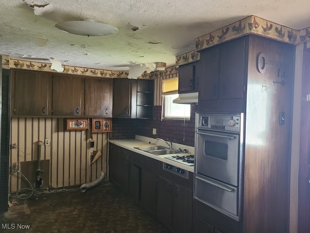 1485 Pike Pkwy, Streetsboro, OH 44241 - kitchen featuring a textured ceiling, a sink, light countertops, a warming drawer, and stainless steel oven