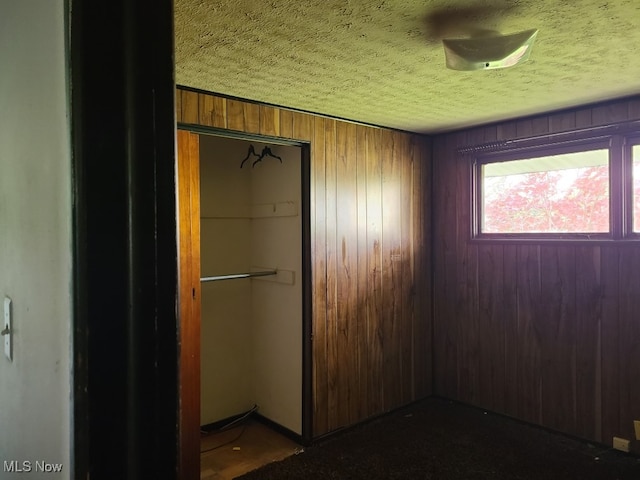 1485 Pike Pkwy, Streetsboro, OH 44241 - interior space featuring wooden walls and a textured ceiling