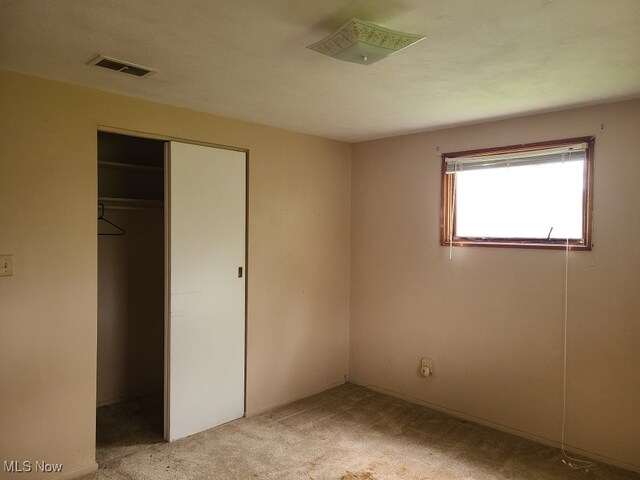 1485 Pike Pkwy, Streetsboro, OH 44241 - unfurnished bedroom with light colored carpet, visible vents, and a closet