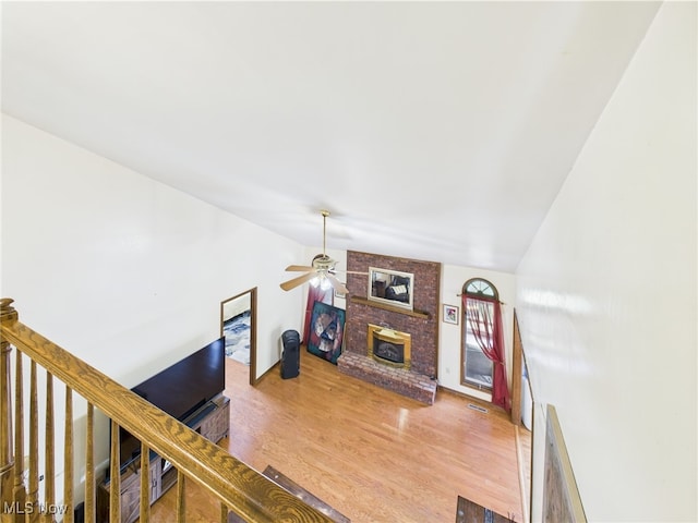 155 Richwood Ct, Belpre, OH 45714 - living room with a ceiling fan, a fireplace, vaulted ceiling, and wood finished floors