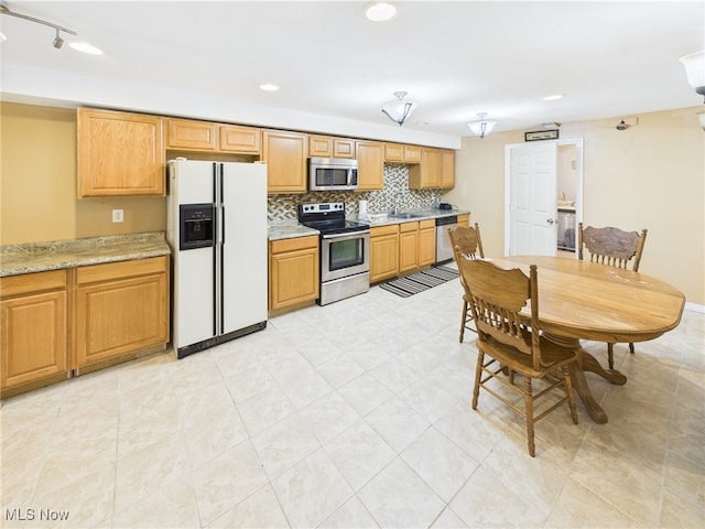 155 Richwood Ct, Belpre, OH 45714 - kitchen featuring backsplash, stainless steel appliances, recessed lighting, and a sink