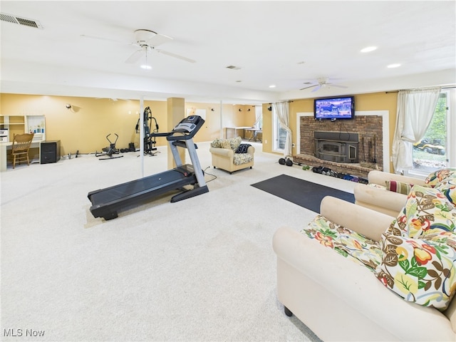 155 Richwood Ct, Belpre, OH 45714 - exercise room featuring a ceiling fan, carpet flooring, a brick fireplace, and visible vents
