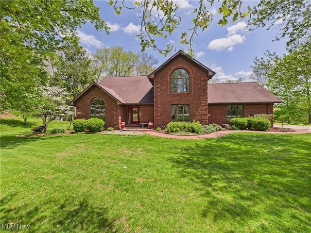 155 Richwood Ct, Belpre, OH 45714 - view of front of house with brick siding, a shingled roof, and a front yard