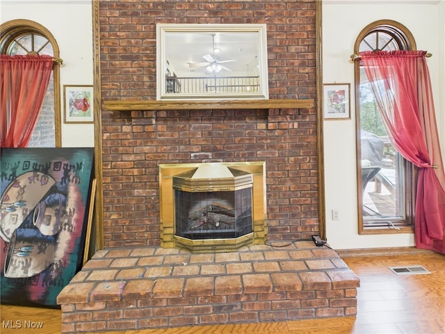 155 Richwood Ct, Belpre, OH 45714 - room details featuring a brick fireplace, ceiling fan, visible vents, and baseboards
