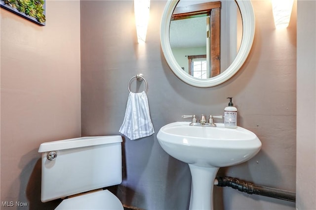 bathroom featuring toilet