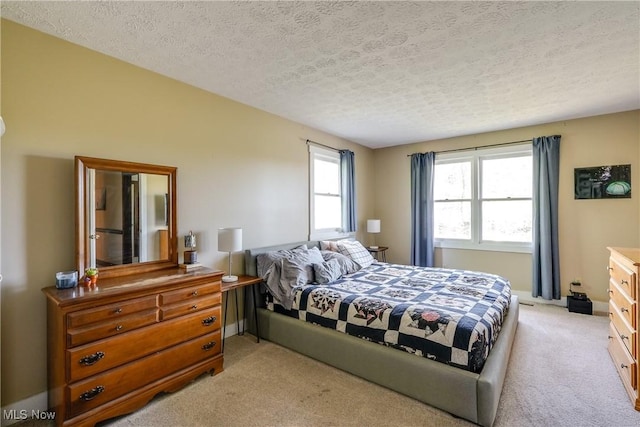 carpeted bedroom with a textured ceiling
