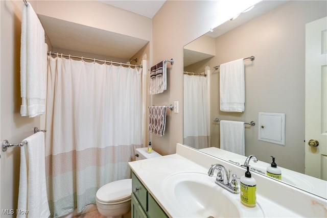 full bathroom with vanity, curtained shower, and toilet