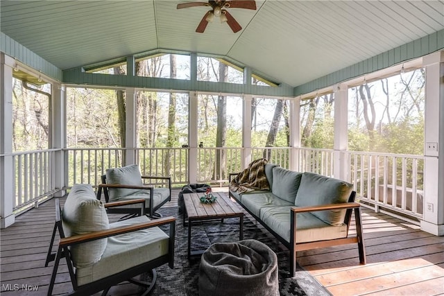 sunroom with a ceiling fan, a wealth of natural light, and an outdoor hangout area