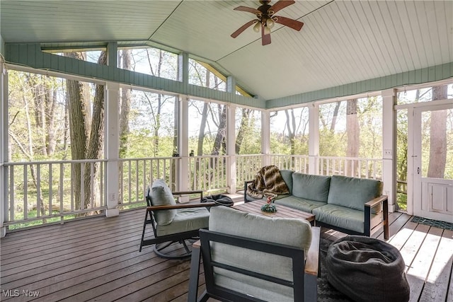 sunroom / solarium with ceiling fan and outdoor lounge area