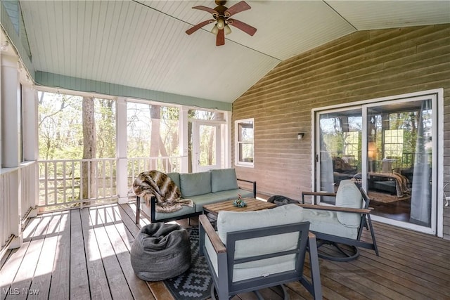 sunroom / solarium with plenty of natural light, ceiling fan, and outdoor lounge area