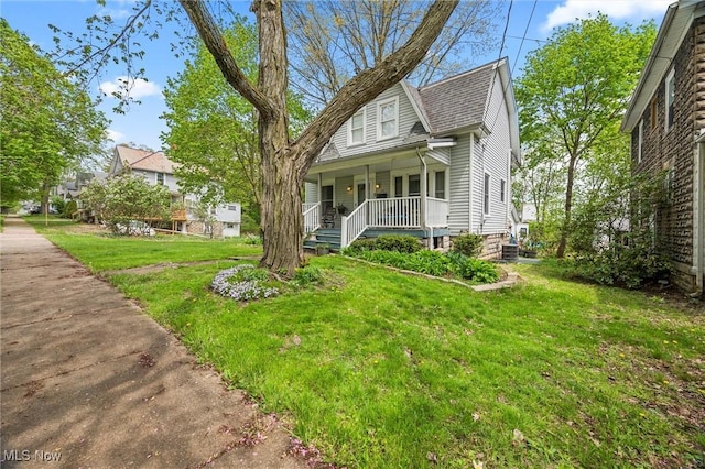 294 Jennings Ave, Salem, OH 44460 - bungalow-style home with a porch and a front lawn