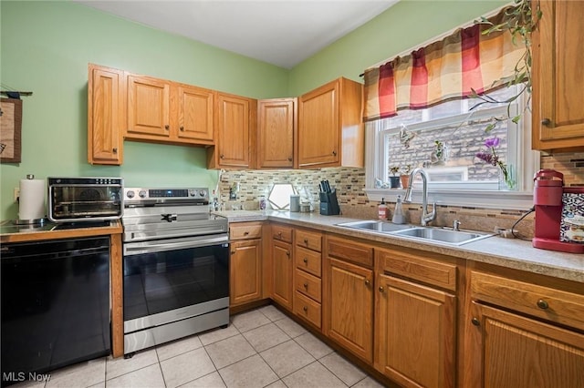 294 Jennings Ave, Salem, OH 44460 - kitchen featuring a toaster, light countertops, a sink, backsplash, and stainless steel electric range oven
