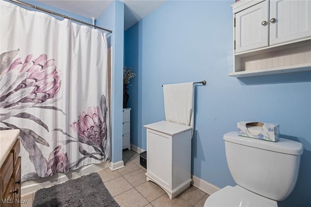 294 Jennings Ave, Salem, OH 44460 - bathroom featuring vanity, shower / bath combination with curtain, toilet, baseboards, and tile patterned floors