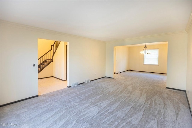 carpeted empty room with a chandelier, baseboards, visible vents, ornamental molding, and stairway